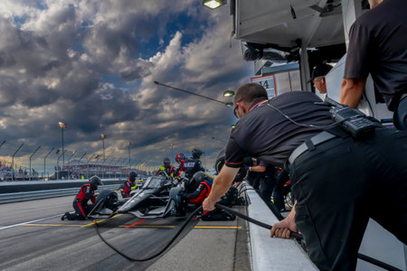 KYLE KIRKWOOD (14) (R) of Jupiter, Florida brings his car in for service during the Bommarito Automotive Group 500 at World Wide Technology Raceway in Madison IL.のeditorial素材