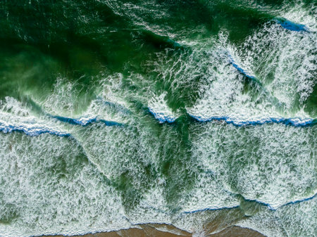 Aerial view of waves hitting the beach on the Oregon coastの写真素材