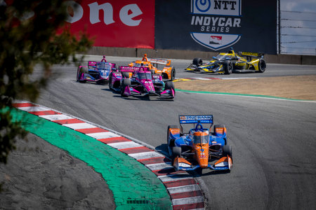 SCOTT DIXON (9) of Auckland, New Zealand races through the turns during the Firestone Grand Prix of...