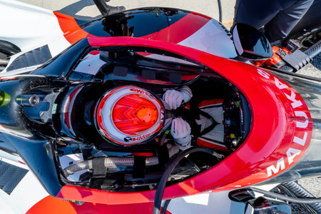 DAVID MALUKAS (18) (R) of Chicago, Illinois  straps into his car for the Firestone Grand Prix of Monterey at the WeatherTech Raceway Laguna Seca in Monterey, CA.のeditorial素材
