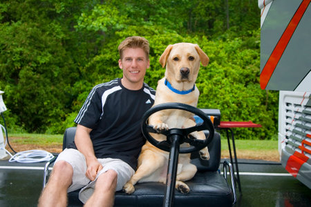 May 05, 2007 - Richmond, VA, USA: Jaimie McMurray poses with his dog, Jake, at the Richmond International Raceway for the running of the Crown Royal presents the Jim Stewart 400 NASCAR Nextel Cup race in Richmond, VA.のeditorial素材
