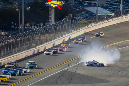DANIEL SUAREZ brings out the caution flag after crashing during the Daytona 500 at the Daytona International Speedway in Daytona Beach FL.のeditorial素材
