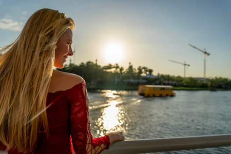 A gorgeous blonde model enjoys the beautiful weather in a major cityの写真素材