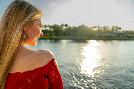 A gorgeous blonde model enjoys the beautiful weather in a major cityの写真素材