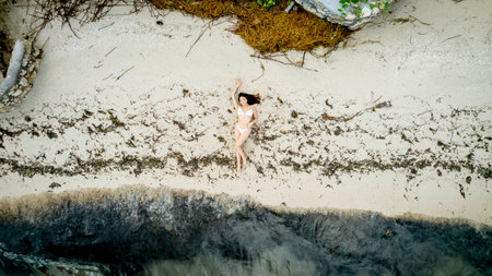 A gorgeous latin model enjoys the beach near the Gulf of Mexico near Sinanche Yucatan Mexicoの写真素材