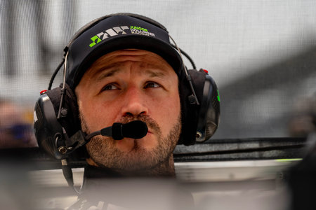 INDYCAR driver, AGUSTIN HUGO CANAPINO (R) (78) of Arrecifes, Argentina, prepares to practice for the Indianapolis 500 at the Indianapolis Motor Speedway in Indianapolis IN, USA.のeditorial素材