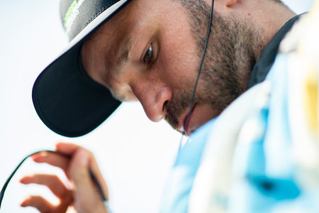 AGUSTIN HUGO CANAPINO (R) (78) of Arrecifes, Argentinasuits up on pit road during a practice session for the Indianapolis 500 at Indianapolis Motor Speedway in Speedway IN.のeditorial素材