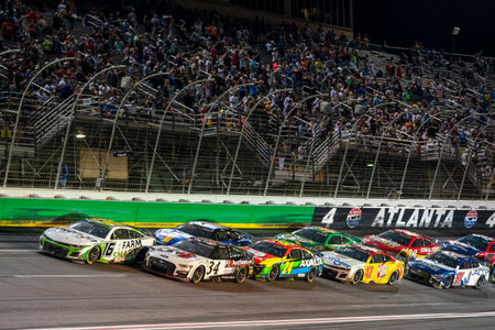 NASCAR Cup Driver, AJ Allmendinger (16) races for position for the Quaker State 400 Available at...