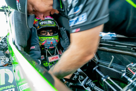 NHRA driver, Leah Pruett, prepares to qualify for the Dodge Power Brokers NHRA Mile-High Nationals...
