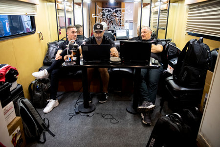 BENJAMIN PEDERSEN (R) (55) of Copenhagen, Denmark goes over film with his driver coach prior to a...