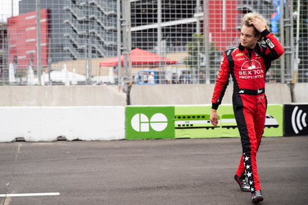 SANTINO FERRUCCI (14) of Woodbury, Connecticut walks on pit road prior to practice for the Honda Indy Toronto  at Exhibtion Place  in Toronto ON.のeditorial素材