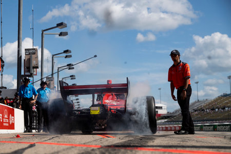 BENJAMIN PEDERSEN (R) (55) of Copenhagen, Denmark drives on pit road during practice for the HyVee Indycar Weekend  at Iowa Speedway in Newtown IA.のeditorial素材