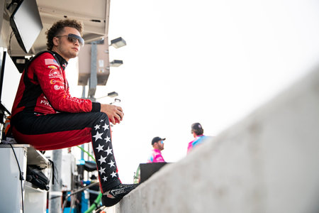 SANTINO FERRUCCI (14) of Woodbury, Connecticut suits up on pit road prior to a practice session for the HyVee Indycar Weekend  at Iowa Speedway in Newtown IA.のeditorial素材