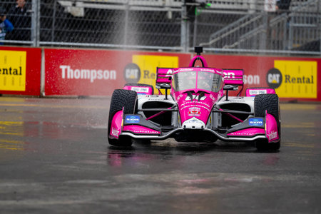 INDYCAR Series driver, HELIO CASTRONEVES (06) of Sao Paulo, Brazil, travels through the turns during a wet and dangerous practice session for the Big Machine Music City Grand Prix at Streets of Nashville in Nashville TN.のeditorial素材