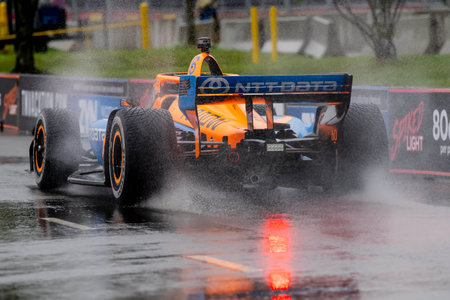 INDYCAR Series driver, FELIX ROSENQVIST (6) of Varnamo, Sweden, travels through the turns during a wet and dangerous practice session for the Big Machine Music City Grand Prix at Streets of Nashville in Nashville TN.のeditorial素材