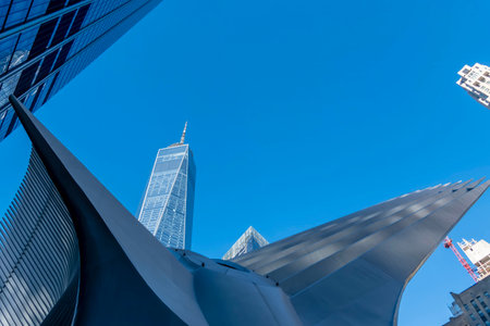 January 16, 2023 - New York, NY, USA: The Freedom Tower in New York City against a blue sky