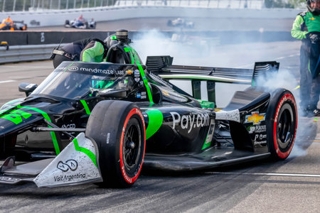 INDYCAR Series driver, AGUSTIN HUGO CANAPINO (R) (78) of Arrecifes, Argentina, brings his car in for...