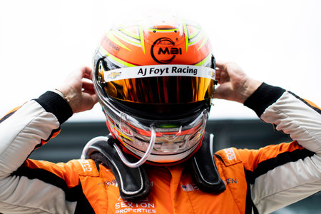 BENJAMIN PEDERSEN (R) (55) of Copenhagen, Denmark suits up on pit road prior to qualifying for the...