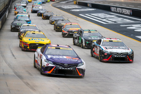 NASCAR Cup Series Driver Denny Hamlin (11) races for position for the Bass Pro Shops Night Race at the Bristol Motor Speedway in Bristol TN.のeditorial素材