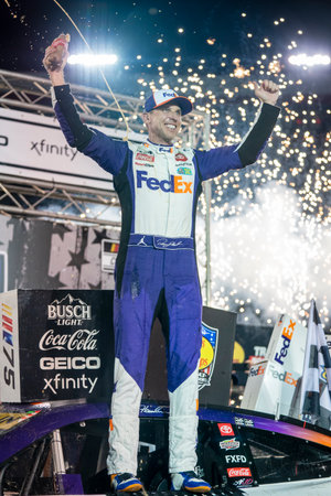 NASCAR Cup Series Driver Denny Hamlin (11) celebrates his win for the Bass Pro Shops Night Race at the Bristol Motor Speedway in Bristol TN.のeditorial素材