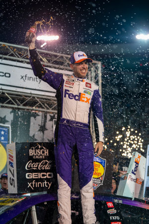 NASCAR Cup Series Driver Denny Hamlin (11) celebrates his win for the Bass Pro Shops Night Race at the Bristol Motor Speedway in Bristol TN.のeditorial素材
