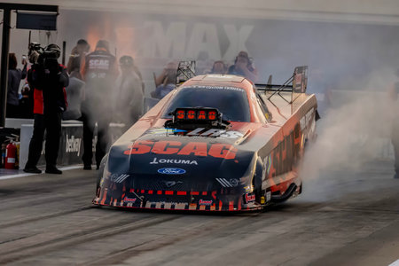 Sep 22, 2023-Concord, NC:  NHRA Funny Car Series driver, Cruz Pedregon, runs down the lane during a...