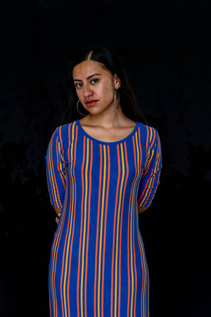 Photo of young latin woman with style make-up in a studio environment. Fashion model and water. Fashion concept.の写真素材