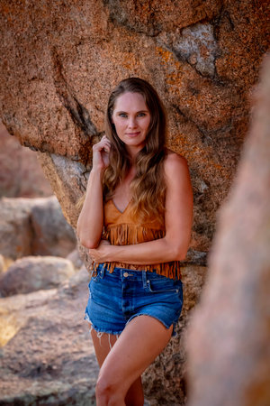 A gorgeous brunette model poses outdoors while enjoying the autumn weatherの写真素材