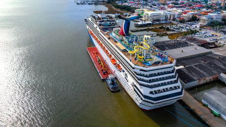 Carnival Sunshine, back from a 5-day Caribbean cruise, graces Charleston Harbor, SC, a vibrant symbol of maritime adventure and leisure.のeditorial素材