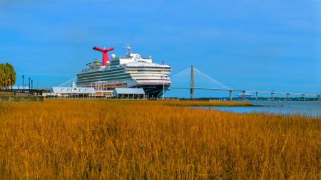 Carnival Sunshine, back from a 5-day Caribbean cruise, graces Charleston Harbor, SC, a vibrant symbol of maritime adventure and leisure.のeditorial素材