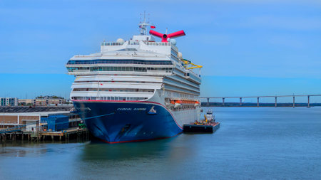 Carnival Sunshine, back from a 5-day Caribbean cruise, graces Charleston Harbor, SC, a vibrant symbol of maritime adventure and leisure.のeditorial素材