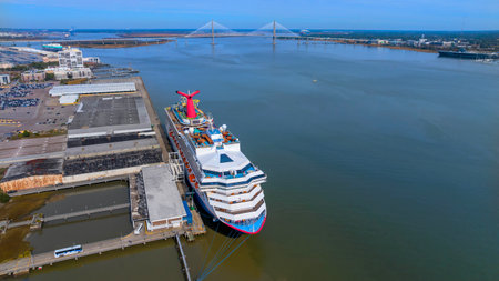 Carnival Sunshine, back from a 5-day Caribbean cruise, graces Charleston Harbor, SC, a vibrant symbol of maritime adventure and leisure.のeditorial素材