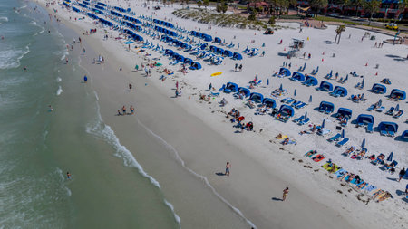 Capturing Clearwater Beach's vibrant Spring Break from aboveâa drone's perspective reveals sun-kissed shores, lively crowds, and joyful beachgoers savoring the warmth of a perfect spring day.の写真素材