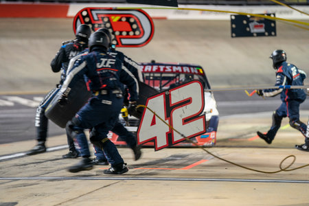 Mar 16, 2024-Bristol, TN;  Matt Mills races for position for the Weather Guard Truck Race in Bristol, TN, USA.のeditorial素材