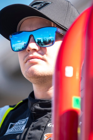 Justin Haley waits for practice to begin for the Shiners Children's 500 in Avondale, AZ, USA.