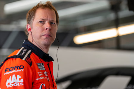Brad Keselowski waits for practice to begin for the Shiners Children's 500 in Avondale, AZ, USA.