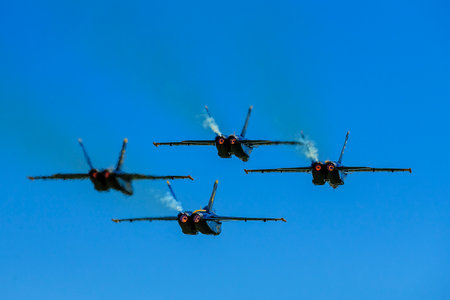 March 01, 2024-El Centro, CA:  Blue Angels rehearse precision aerobatics before season debut, showcasing skill and teamwork in high-flying maneuvers.のeditorial素材