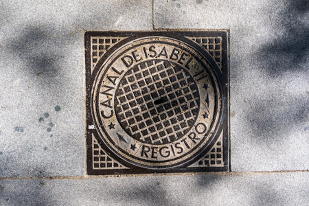 Madrid's cityscape enriched by artistically crafted manhole covers, weaving culture into urban fabric, a testament to city's vibrant identityのeditorial素材