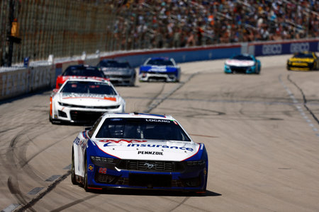 Joey Logano races for the AutoTrader EchoPark Automotive 400 in Fort Worth, TX, USA.のeditorial素材
