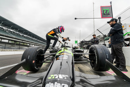 ROMAIN GROSJEAN (77) of Geneva, Switzerland straps into his vehicle as he prepares to practice for...