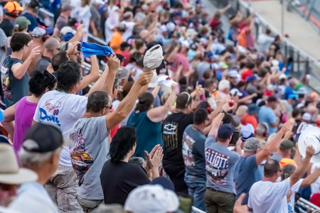 Fans watch their favorite drivers race at Talladega Superspeedway, in the United Rentals 250.  An exhilarating event showcasing high-speed action and skill in the heart of Lincoln, AL.のeditorial素材
