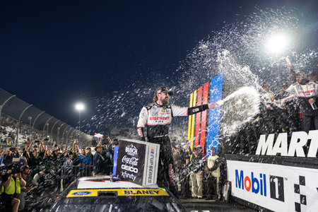 NASCAR Cup Series driver, RYAN BLANEY (12) of High Point, NC, celebrates his win for the Xfinity 500 at Martinsville Speedway in Ridgeway, VA.のeditorial素材