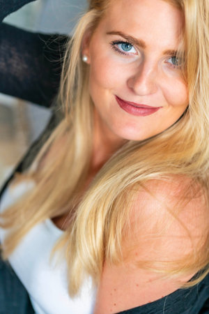 A gorgeous blonde model enjoys a day at home before workの写真素材
