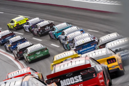 JOHN HUNTER NEMECHEK (42) of Mooresville, NC races through the turns during the Ambetter Health 400...
