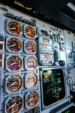 A commercial cargo aircraft rests on the tarmac of a bustling international airport, its massive...