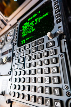 A commercial cargo aircraft rests on the tarmac of a bustling international airport, its massive...