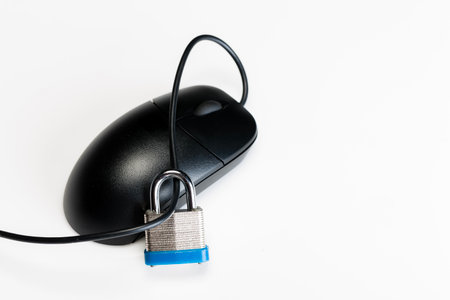 A computer mouse with a padlock symbolizing internet securityの写真素材