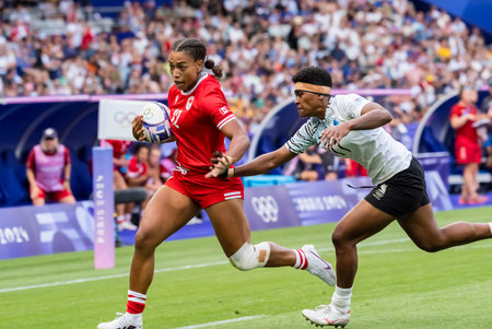 Canada back KEYARA WARDLEY (CAN) (12) competes in the Women's Rugby Sevens Pool A match at the Stade de France Stadium during the 2024 Paris Summer Olympics in Paris, France.のeditorial素材