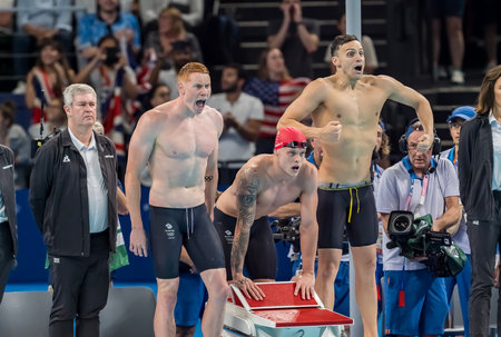 James Guy (GBR), Duncan Scott (GBR), Tom Dean (GBR), and Matthew Richards (GBR) celebrate after winning the gold medal in the Men's 4 X 200m Freestyle Relay at the Paris La Defense Arena during the 2024 Paris Summer Olympics in Paris, France.のeditorial素材