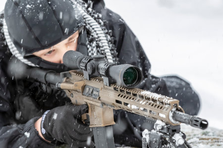 A young soldier trains with his weapon in a harsh snowstorm, braving icy winds and frozen terrain, his focus sharp and determined amid the rugged, wintry outdoor environment.の写真素材